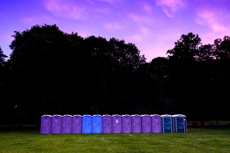 in a row, public washroom, outdoors, boxes, beauty in nature, green color, tranquility, purple, blue, growth, silhouette, photography, behind, trees, plant