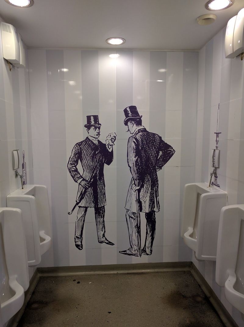 clothing, services, human representation, clean, domestic bathroom, lighting equipment, domestic room, reflection, wall - building feature, urinal, female likeness