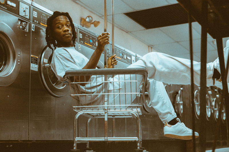 laundromat photoshoot, indoors, shirt, grunge, men, full length, cart, inside, adult, wearing, females, machine, 4K, hood, real people, child, room, childhood