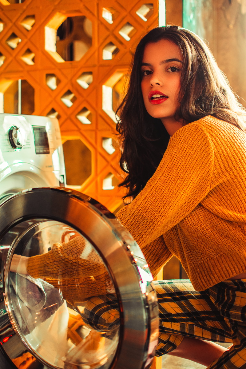 daytime, waist up, pose, wearing, portrait, looking at camera, fashion, lady, laundromat, hair, photoshoot, glamour, adult, sweater, beauty, posing, wear