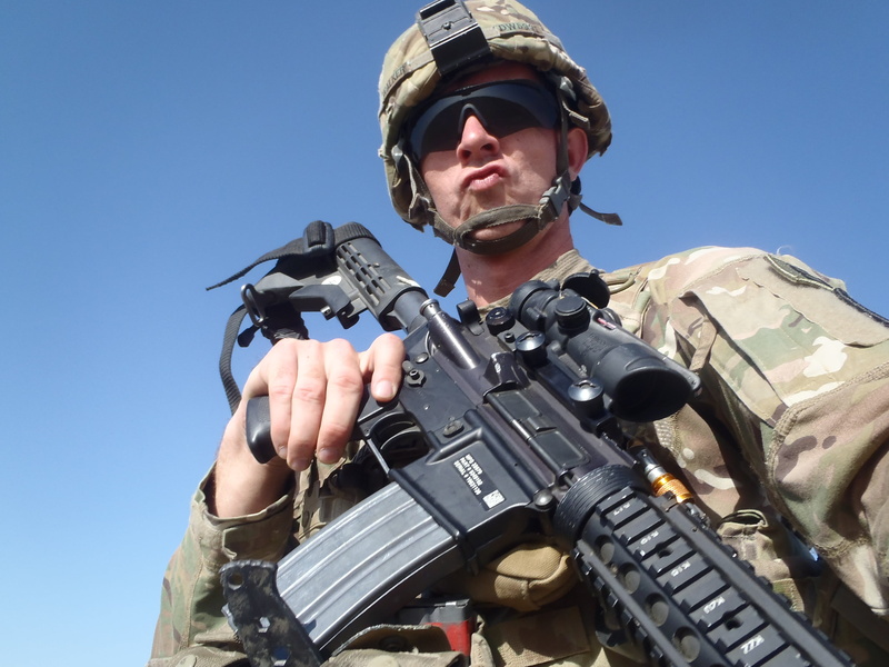 front view, outdoors, one person, day, portrait, 2K, government, military uniform, aiming, special forces, cool, rifle, army, aggression, holding, weapon