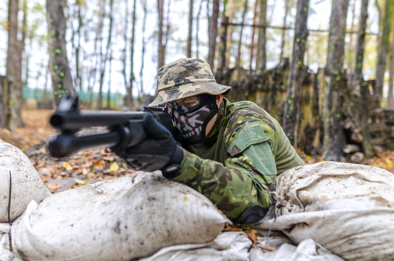government, man, male, mask, person, woods, wear, holding, lying down, men, people, automatic, adult, aggression, army, gun, camouflage clothing, combat
