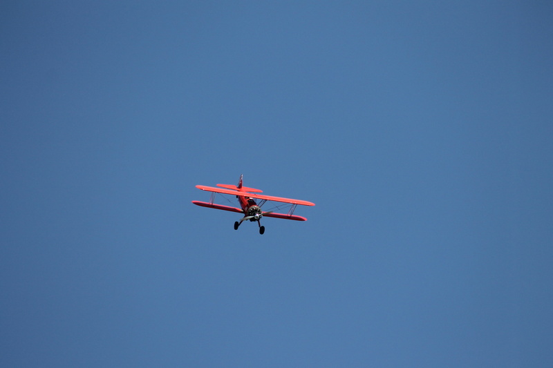 mode of transportation, clear sky, copy space, transportation, private airplane, motion, aerobatics, plane, mid-air, propeller, low angle view, sky, flying
