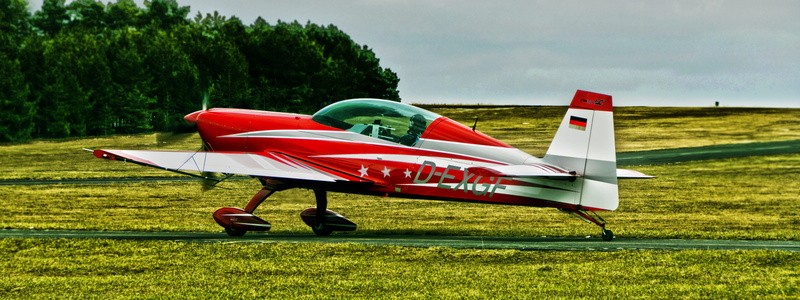 sport, day, airplane, flight, flying, no people, aerospace industry, piston-single, green color, sky, transportation, land, mode of transportation, air sports