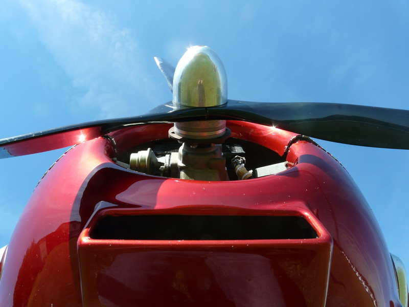 day, outdoors, cockpit, speed, red, transportation, low angle view, blue, helmet, Propeller, airplane, headwear, no people, 2K, nature, sky, silver, front view