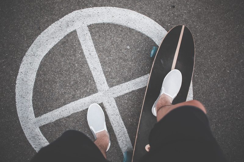 cross, high angle view, hand, human leg, slip-ons, lifestyles, people, adults only, street, communication, sport, standing, city, real people, guidance