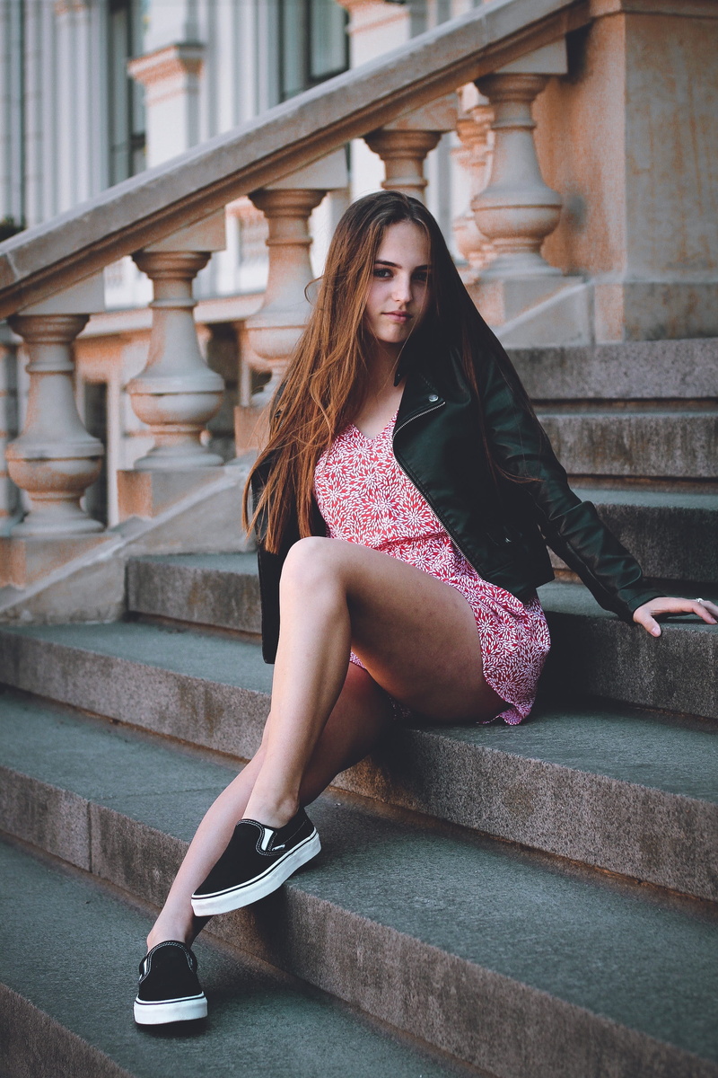 steps, teenager, built structure, real people, casual clothing, staircase, sneakers, girl, full length, style, pillar, person, leather jacket, hair, shoe