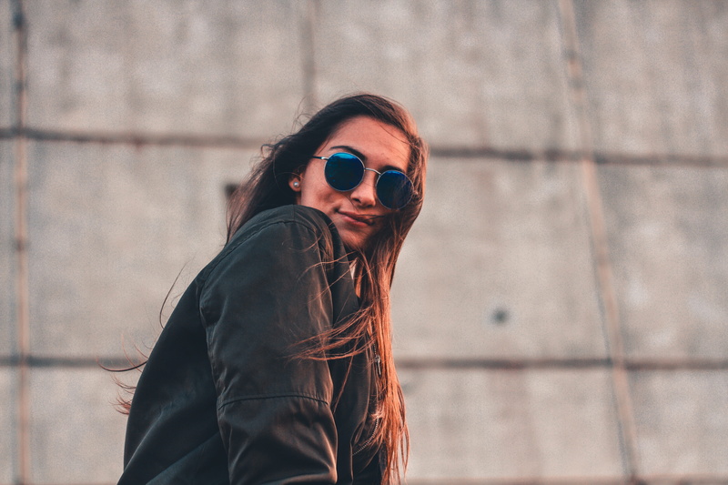 young adult, looking at camera, day, sunglasses, person, urban, model, beautiful woman, jacket, wear, standing, one person, real people, fashion, leather