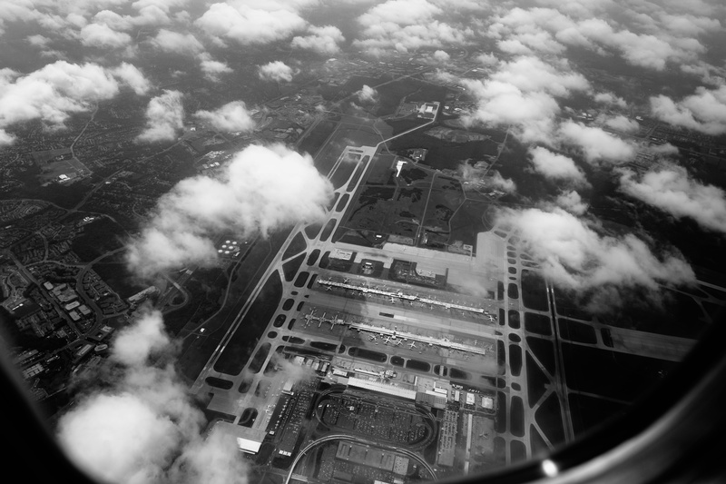 above, mode of transportation, sky, pollution, runway, dulles international airport, aerial view, plane, smoke - physical structure, terminal, high angle view