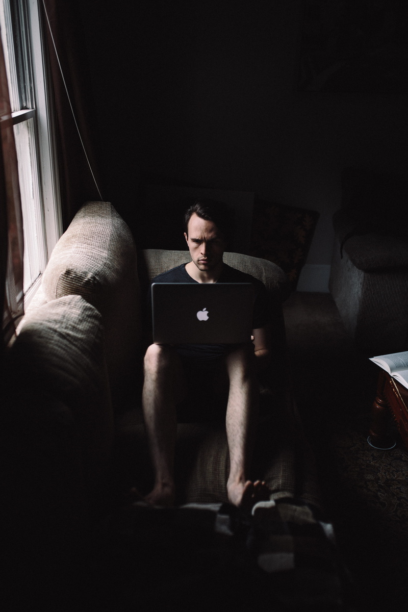 window, couch, mature men, alone, sofa, apple, armchair, technology, communication, one person, men, beside, adult, seating, furniture, domestic room, man