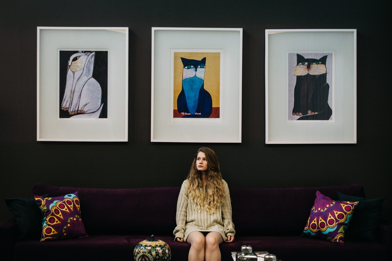 young Adult, living Room, studio Shot, adult, textile, simmetry, domestic Room, fashionable, sitting, modern, three, cat, lifestyles, women, clothing, home Interior