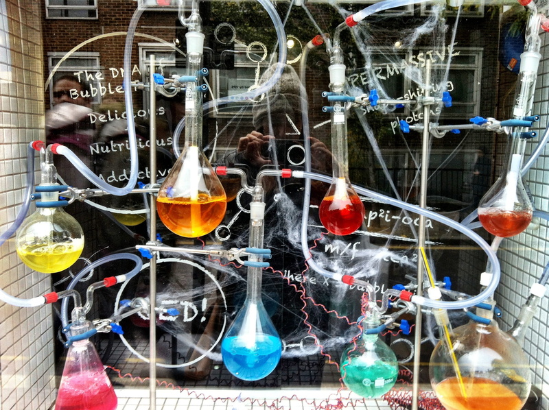 multi colored, glass, glass - material, flasks, arrangement, filled, retail, showcase, decoration, for sale, photo, window, large group of objects, day