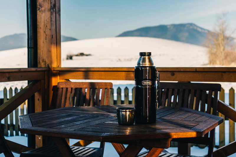 coffee, glass - material, table, patio, no people, chair, travel, restaurant, outdoors, empty, glass, thermos, seat, flask, business, beauty in nature
