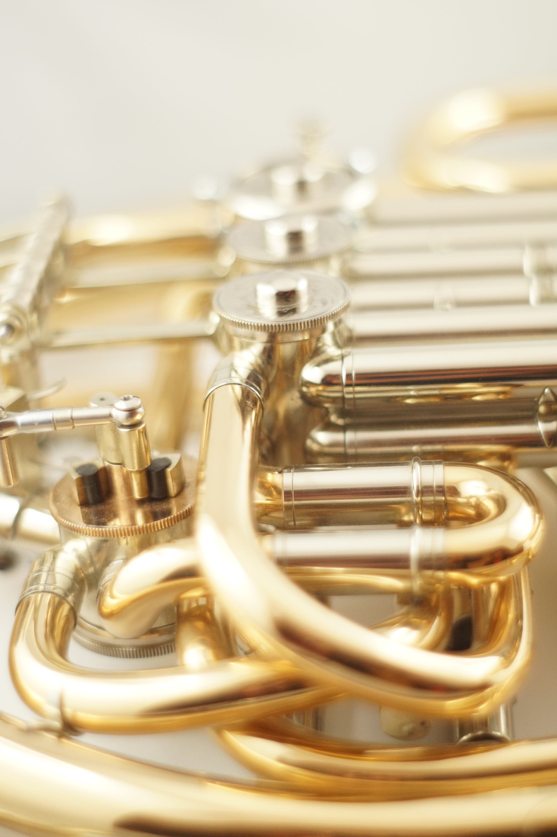 white background, close-up, table, brass instrument, studio shot, detail, wind instrument, music, instrument, Musical Instrument, arts culture and entertainment