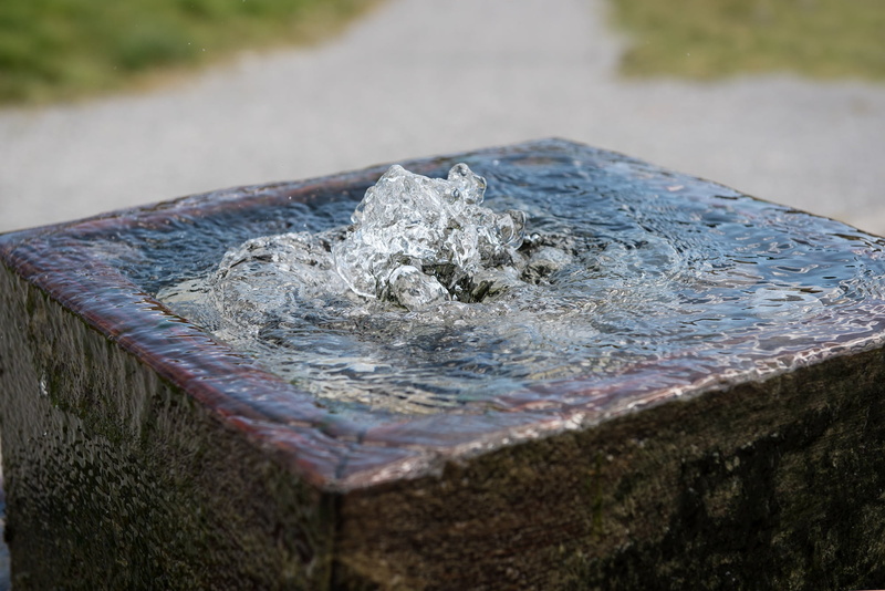 close, fountain, shape, purity, tree stump, water, old, focus on foreground, bark, in motion, wood - material, metal, high angle view, plant, selective focus