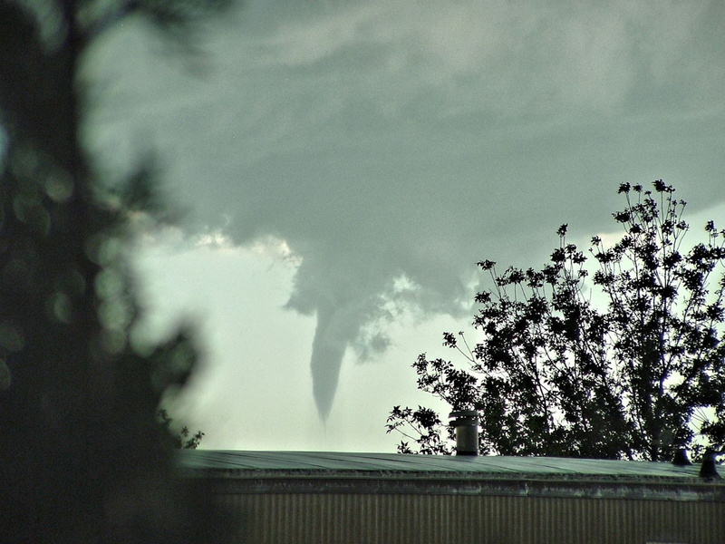 beauty in nature, emitting, day, silhouette, nature, smoke, factory, cloudy, dark sky, water, trees, environment, air pollution, funnel cloud, pollution