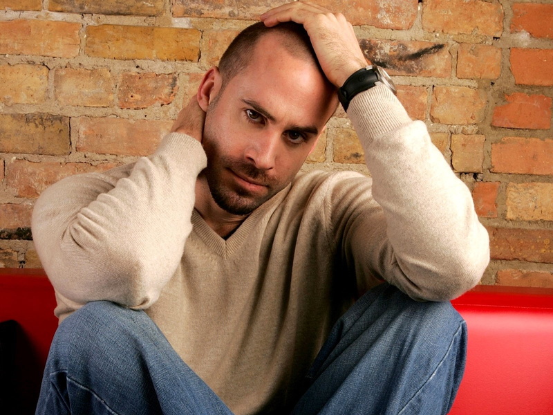 contemplation, neck, brick Wall, people, sofa, casual Clothing, one Person, leisure activity, fashion, real people, gray, photoshoot, sweater, joseph fiennes