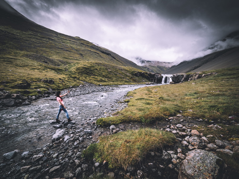 blue, beauty in nature, denim, nature, jeans, lifestyles, wearing, cloud, green, standing, crossing, solid, valley, green grass, mid adult, shirt, hiking