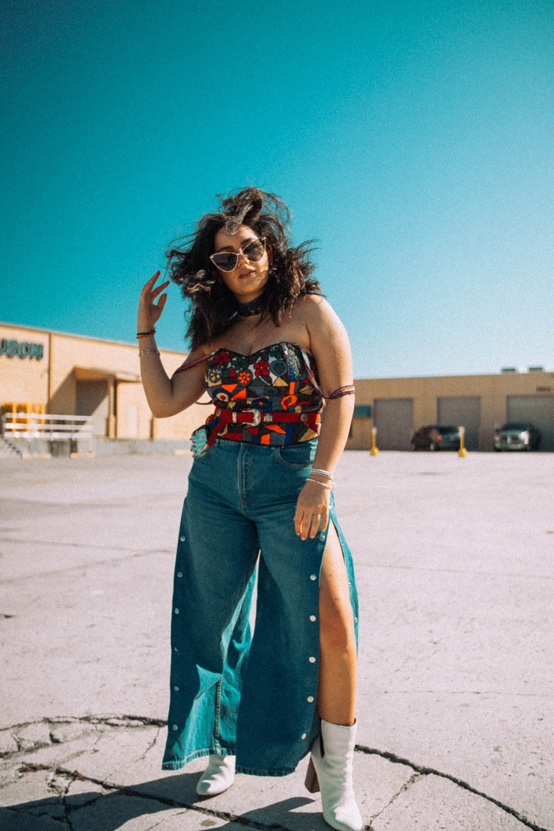woman, parking, chaps, casual clothing, wearing, gray, strapless, clear sky, standing, person, hair, portrait, nature, one person, hairstyle, leisure activity