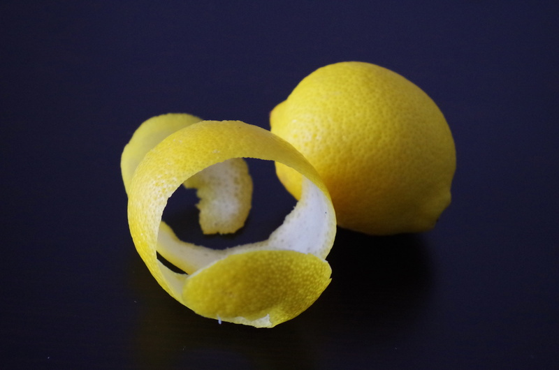 surface, black background, slice, peel, lemon peel, yellow, food, healthy eating, close-up, group of objects, freshness, studio shot, three objects, fruit