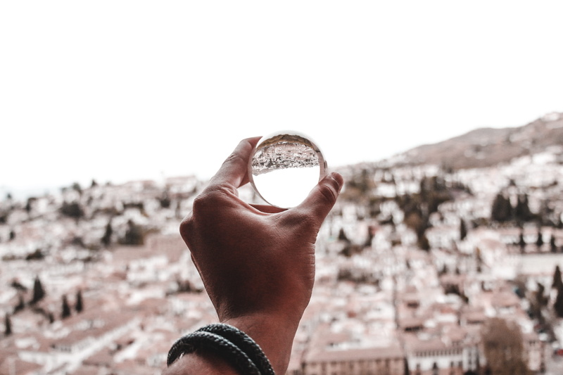 personal perspective, lifestyles, close-up, one person, nickel, hand, built structure, thumbs up, magnifying, coin, face, holding, architecture, unrecognizable person