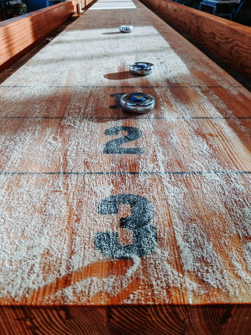 table, no people, medication, plywood, pattern, coin, rug, number, money, symbol, boardwalk, stained wood, pill, day, communication, built structure, close-up