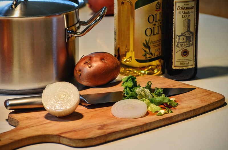 household equipment, Olive Oil, bottle, home, domestic kitchen, saucepan, chopping board, Onion, cutting board, 4K, knife, gray, indoors, table, wellbeing