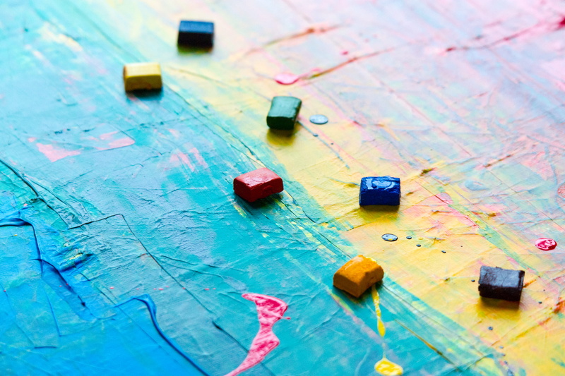 color, table, canvas, vibrant color, creative, text, high angle view, painting, wood - material, assorted, still life, map, art, paints, cubes, colorful