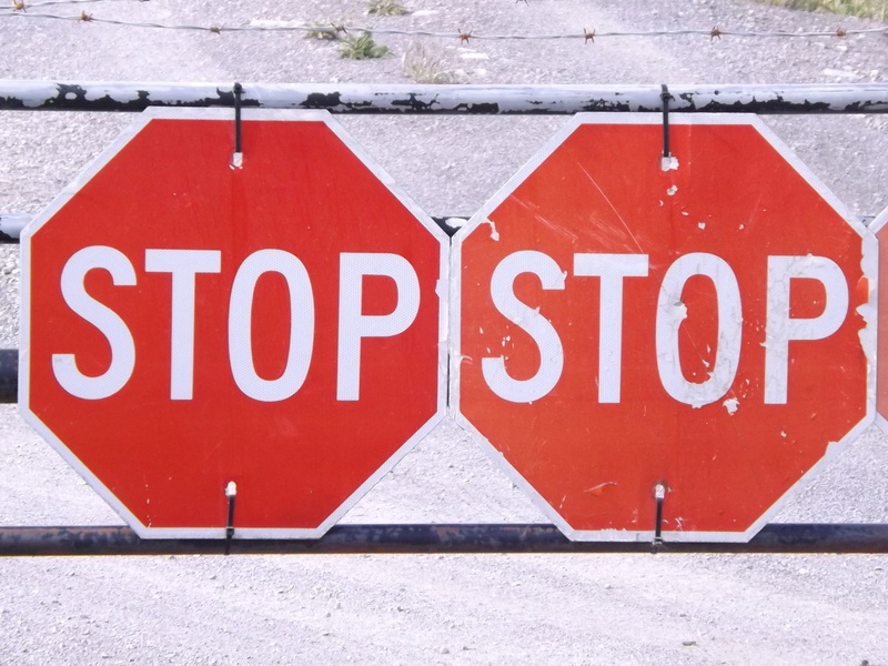warning sign, caution, white, western script, street, text, transportation, attention, guidance, safety, no people, built structure, word, communication