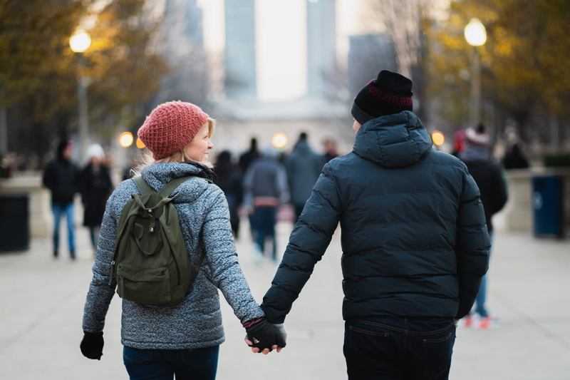 lifestyles, clothing, together, city life, city, cute, standing, jackets, cold, hands, blur, architecture, in love, urban, adults, holding hands, outdoors