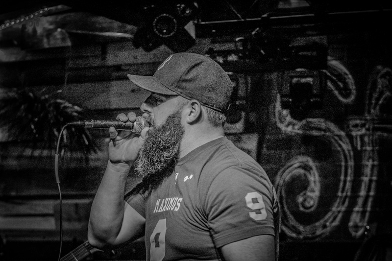 person, side view, black-and-white, concert, facial hair, clothing, music, waist up, cap, portrait, mid adult, man, glasses, lifestyles, hand, live performance