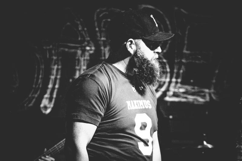 man, muscular, standing, person, real people, fashion, cap, hat, dark, waist up, looking, full beard, photography, front view, young men, male, clothing