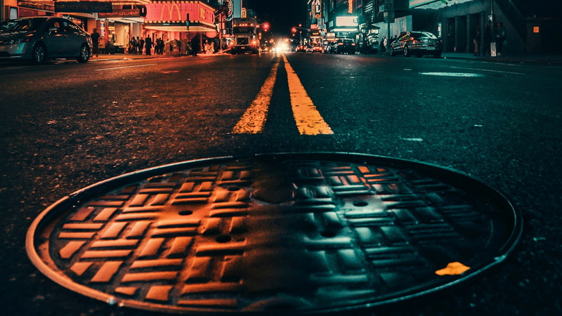 asphalt, city, close-up, land vehicle, night, midnight, outdoors, street, darkness, manhole, incidental people, sign, 1080P, illuminated, car, reflection