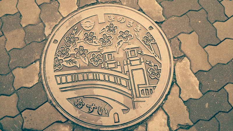 finance, art and craft, western script, representation, shape, close-up, the manhole, pattern, craft, high angle view, design, no people, outdoors, crab