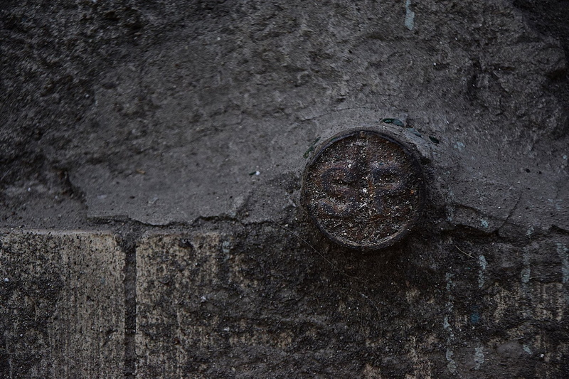 day, dark, no people, tube, weathered, wet, wall - building feature, old, road, outdoors, textured, backgrounds, minimum, run-down, shape, manhole, circle