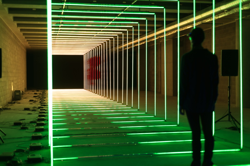 standing, full length, green color, rear view, railing, banister, neon, purple, direction, built structure, person, corner, led, men, real people, architecture