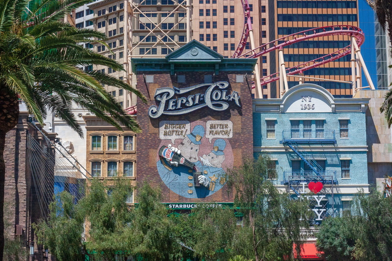 no people, building exterior, low angle view, text, coaster, pepsi, tree, tropical climate, nature, graffiti, funfair, window, art and craft, flora, united states