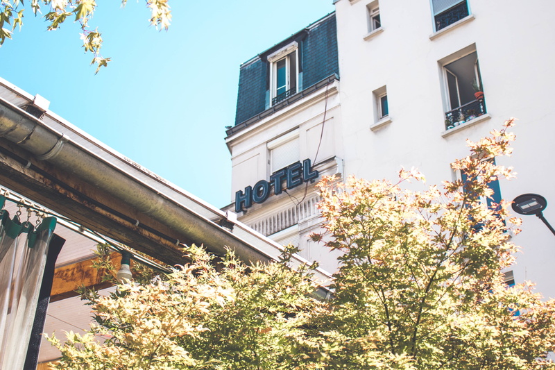 paris, advert, tree, roof, fragility, low angle view, hostel, sign, nature, recyclerie, cherry blossom, built structure, france, hotel, green