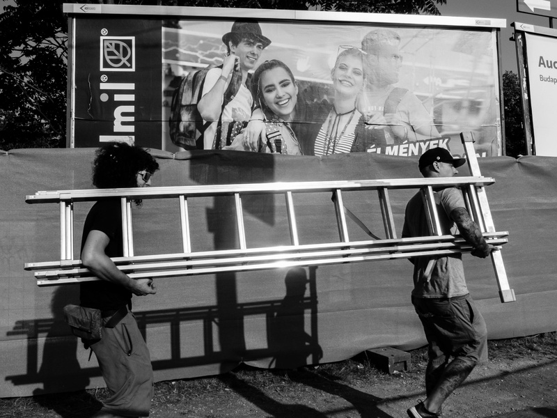 advertisement, ladder, contrast, budapest, full length, street, standing, 2K, representation, real people, seat, bench, juxtaposition, males, men, black and white