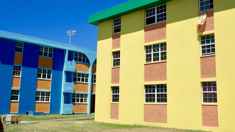 wall - building feature, facade, urban, apartment, row house, housing, building, nature, office building, sky, color, condo, house, grass, slope, campus
