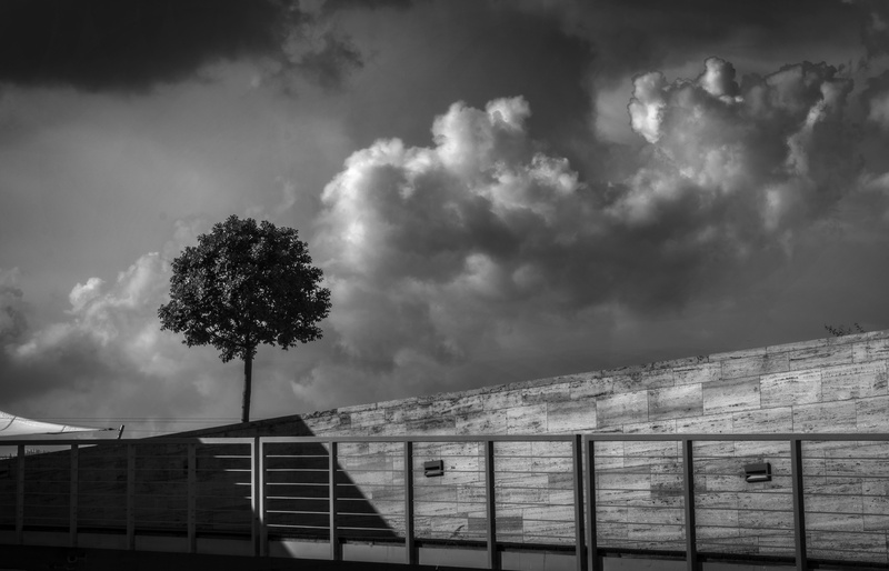 black and white, beauty in nature, architecture, land, no people, sky, building, bleak, cloud - sky, barrier, storm, storm cloud, tree, outdoors, feelings