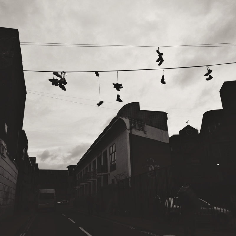 trainers, cable, 2K, sky, shoes, outdoors, day, no people, building exterior, hanging, urban, street, transportation, silhouette, cloud - sky, london
