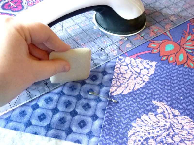 tablecloth, floral pattern, ruler, craft, unrecognizable person, mug, textile, human body part, purple, 2K, homemade, finger, material, quilt, person