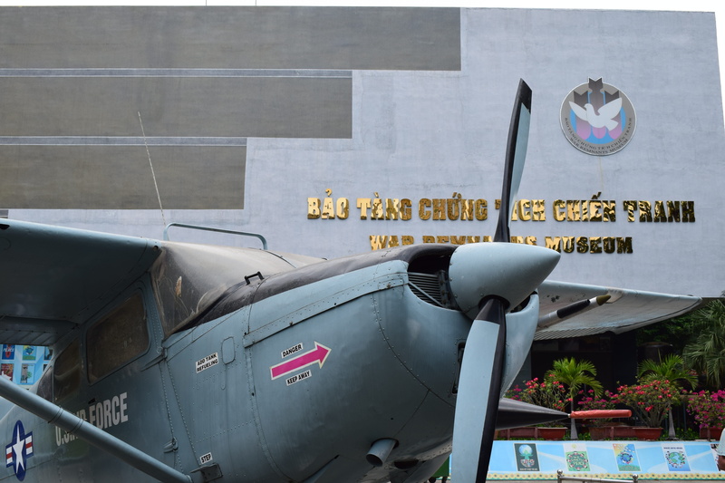 airplane, communication, no people, plane, war, architecture, war remnants museum, day, outdoors, land vehicle, built structure, reflection, vietnam, mode of transportation