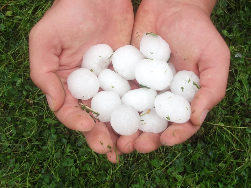 hailing, outdoors, stones, Hail, Ice Rain, person, balls, white, high angle view, land, cold, easter egg, human body part, unrecognizable person, frozen drops