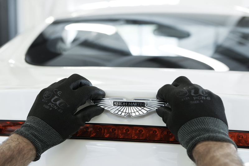 close-up, real people, unrecognizable person, hand, One-77, human finger, human body part, glove, luxury, human hand, Aston Martin, finger, focus on foreground