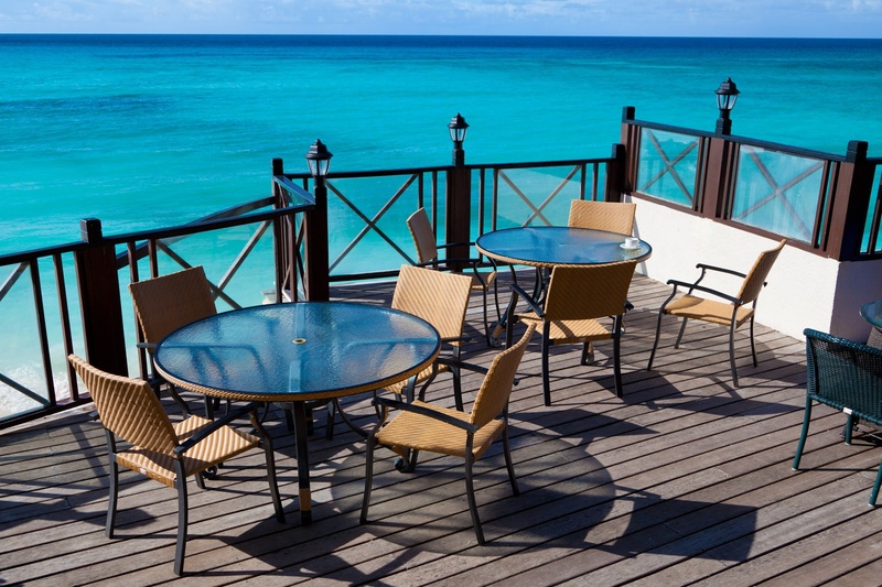 vacation, exotic, horizon over water, two, outdoors, tranquility, vacations, blue, table, sky, sunlight, shadow, water, summer, glass, chair, ocean, round
