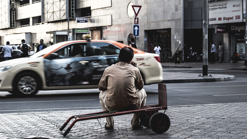 photography, real people, sidewalks, road, rear view, 5K, street, dubai, building exterior, sitting, united arab emirates, mode of transportation, candid