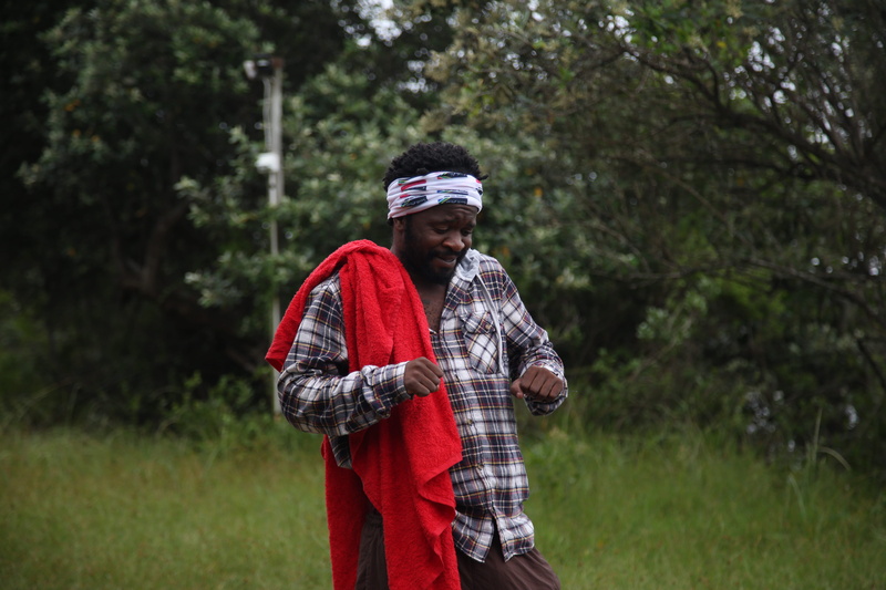 dancing, growth, grass, hat, day, african, clothing, ebony, south african, red, good time, real people, africa, waist up, black, casual clothing, one person