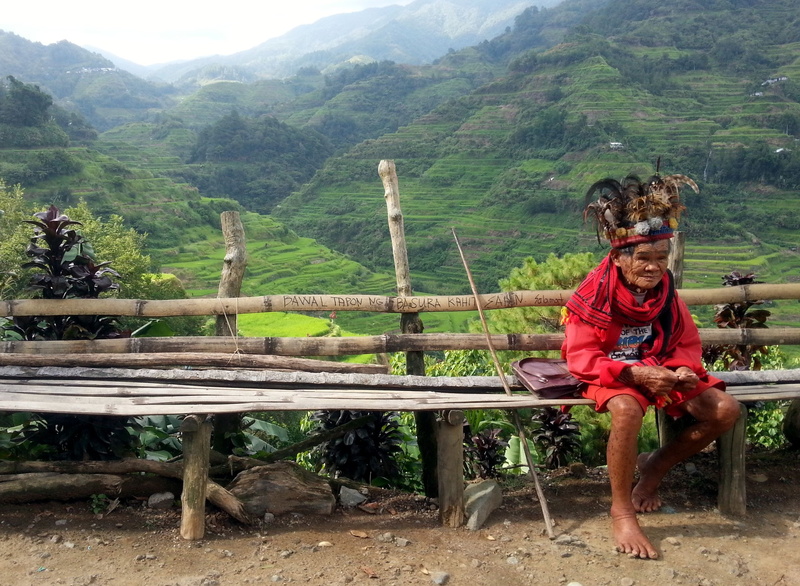 leisure activity, rural scene, mountain, casual clothing, spirituality, railing, tree, tribe, men, culture, outdoors, childhood, mountains, males, plant